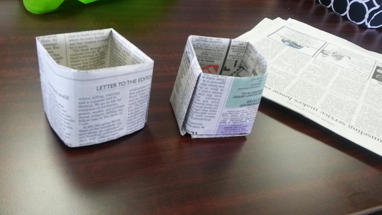 Newspaper planters made with local students
